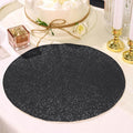 Black glitter table placemat on a beautifully set dining table.