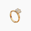 Hand embroidered cotton towel of told ring with a diamond on a white background