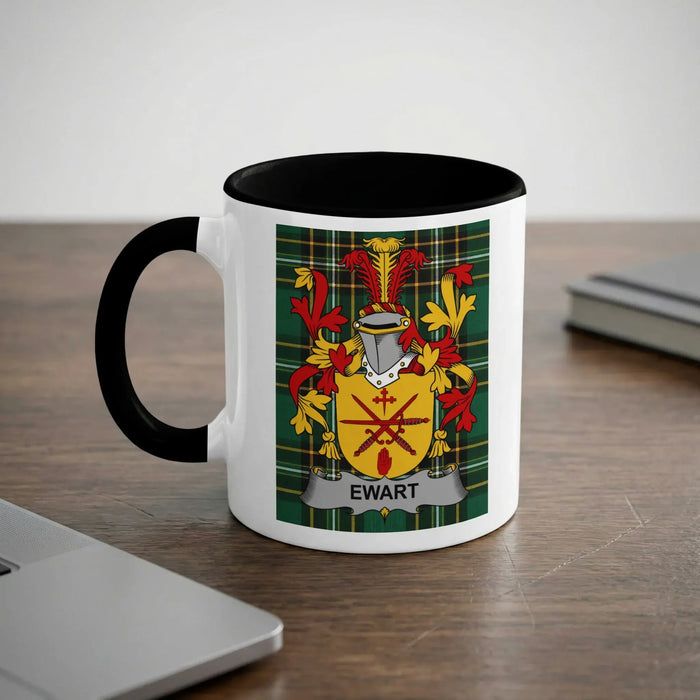 Mug with Ewart family crest on a wooden desk.