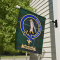 Mitchell Family Crest garden flag beside a porch