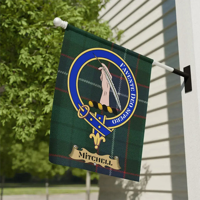 Mitchell Family Crest garden flag beside a porch