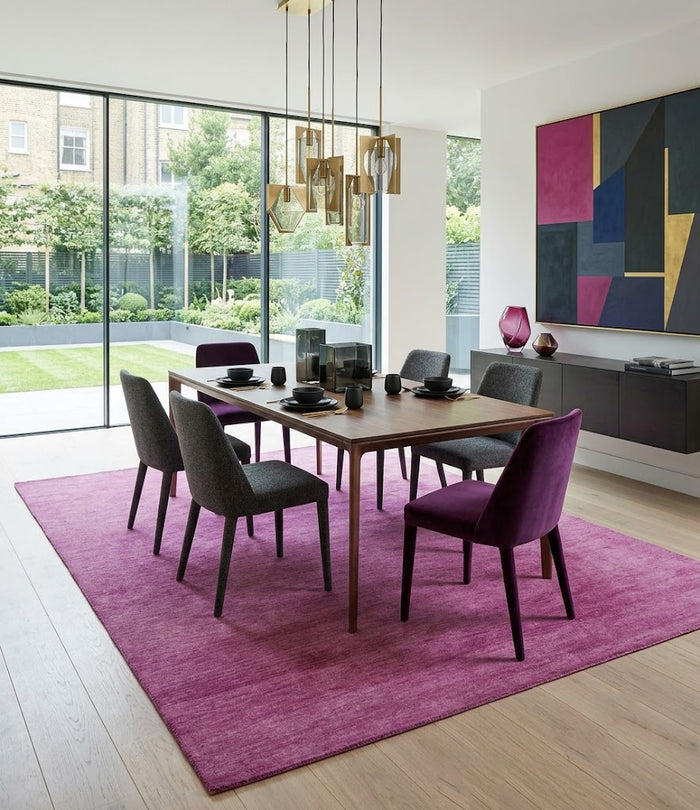 Orchid pink rectangular wool rug with solid color and visible short pile